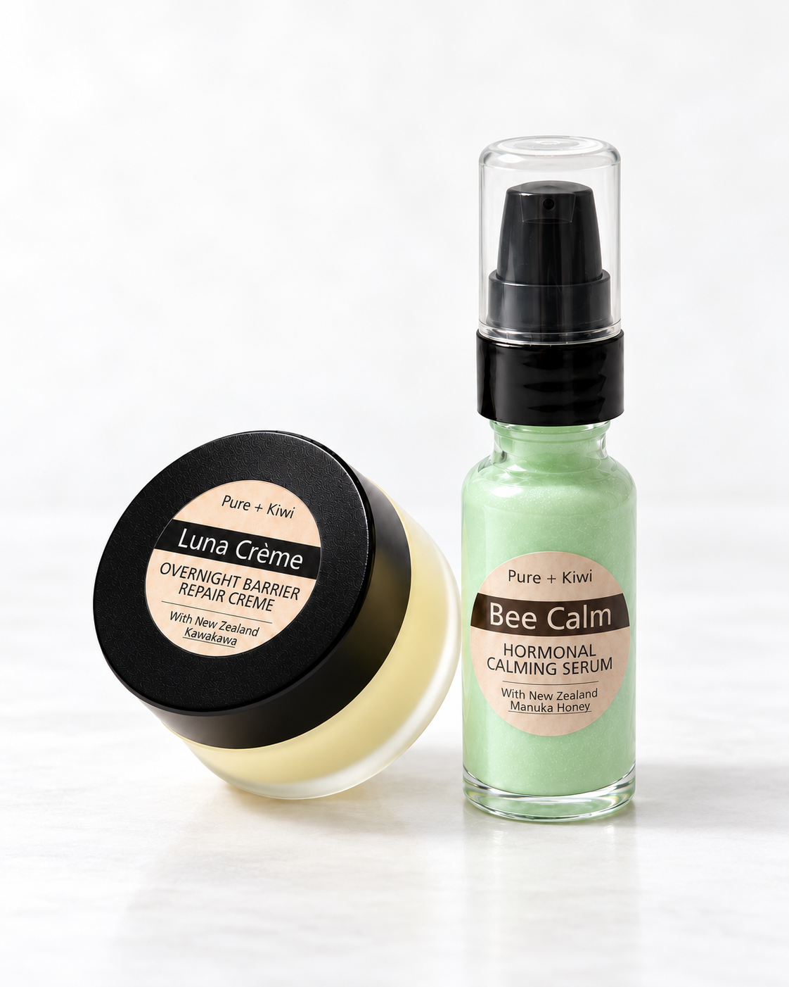 Two skincare products from Pure + Kiwi on a white background: a jar of Luna Crème Overnight Barrier Repair Creme on the left, and a bottle of Bee Calm Hormonal Calming Serum on the right.